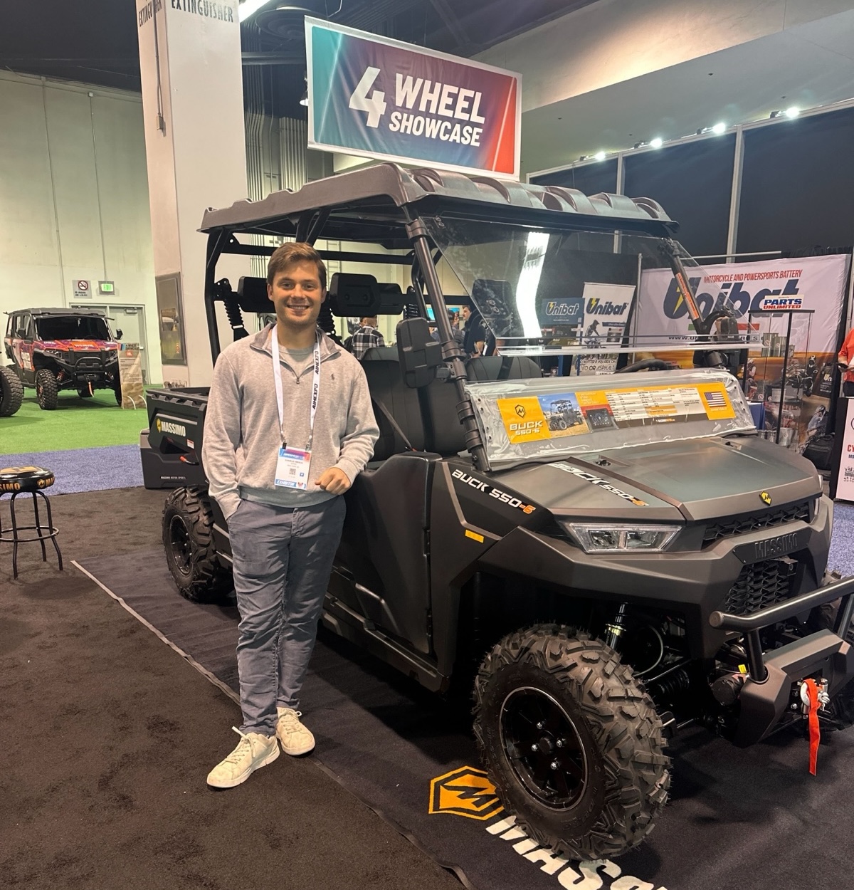 Charlie at the Massimo booth at a powersports trade show